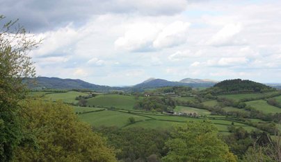A distant view of Caradoc and the  Long Mynd from the Burrow